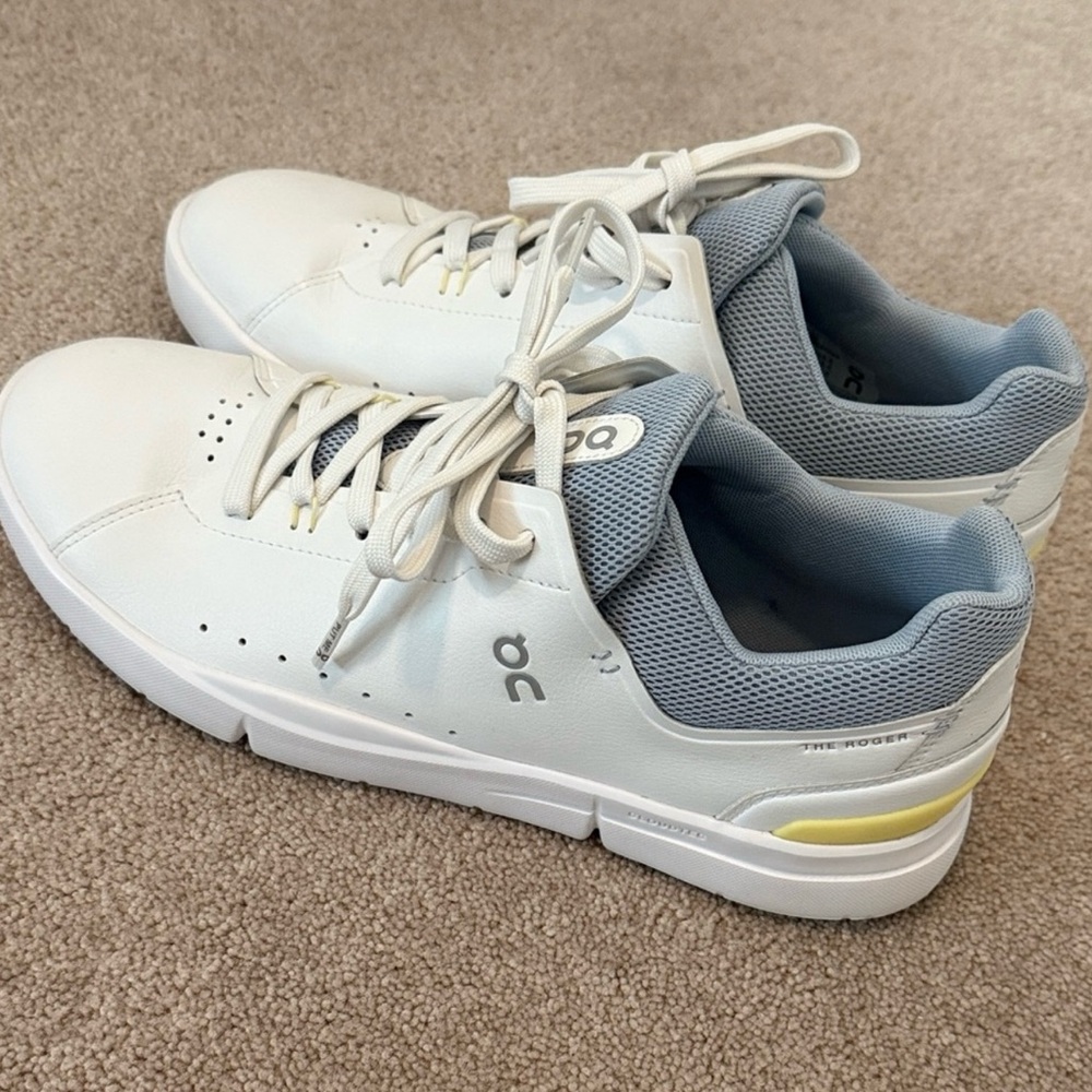 On Running White Sneakers with Light Gray and Yellow Accents